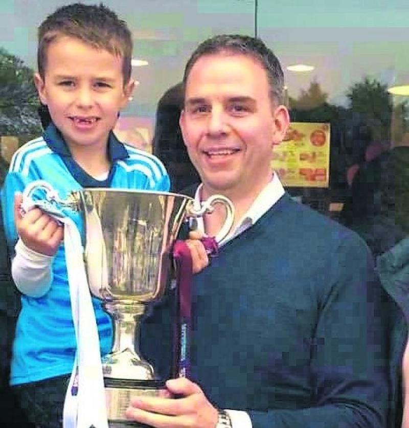 Mark Cunningham proudly holds his son Mark Junior aloft at the newly redeveloped Pizza Hut premises in Longford town