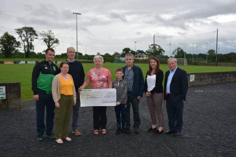 Mrs Maureen Burke presenting Cathal O'Reilly with his cheque for €5,000. Also included in the picture: Cathal's father Michael O'Reilly, Club Treasurer David Barden, Club Secretary Donna Hagan and Com