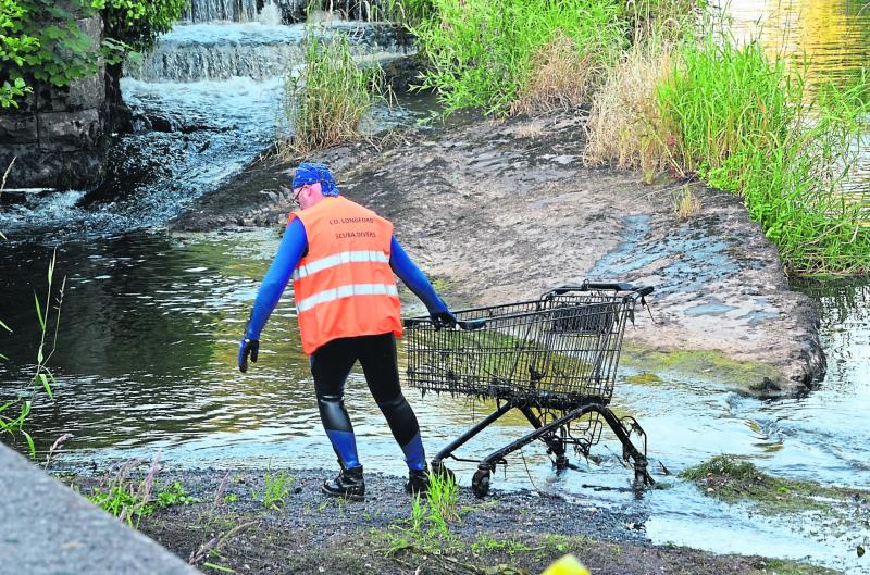 A member of Co. Longford Scuba Divers pulling a trolley out of the river Camlin as part of the Longford Tidy Towns river cleanup