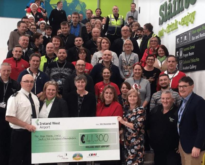 Ireland West Airport staff present a cheque for €41,395 