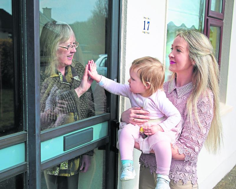 ‘Mother’s Day highlights the distance’ as Longford child visits granny through a window pane