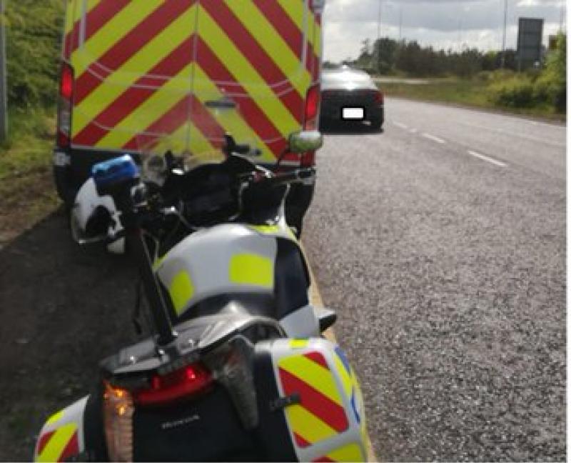 Garda&iacute; catch car driver using mobile phone on major roadway 