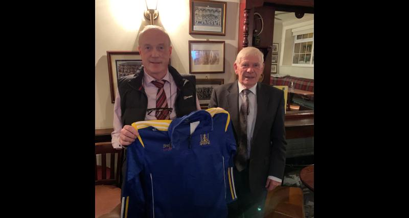 Two legends! Dromard GAA's Charlie Brady makes special presentation to Arva hotelier Eamon Gray 