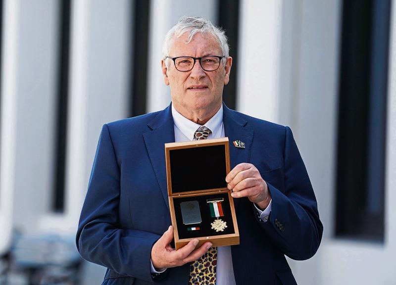  John Donegan, son of late Inspector Sam Donegan, holding the gold Scott Medal awarded to his father last Friday Picture: Brian Lawless/PA