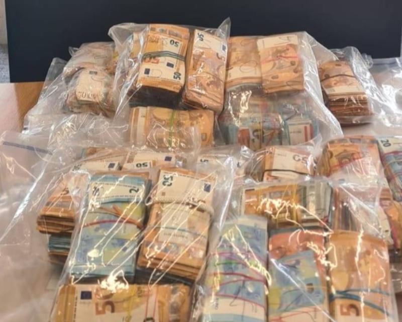 Woman arrested as gardaí seize almost half a million euros in cash