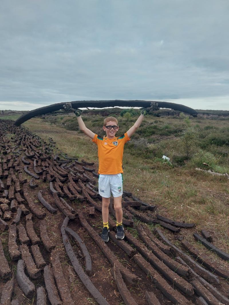 A monster sod! Longford's Jamie McCaffrey with a huge  sod of turf in Abbeyshrule bog 