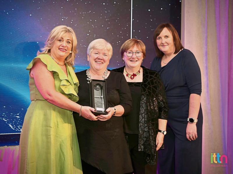 Kane's Travel receiving award