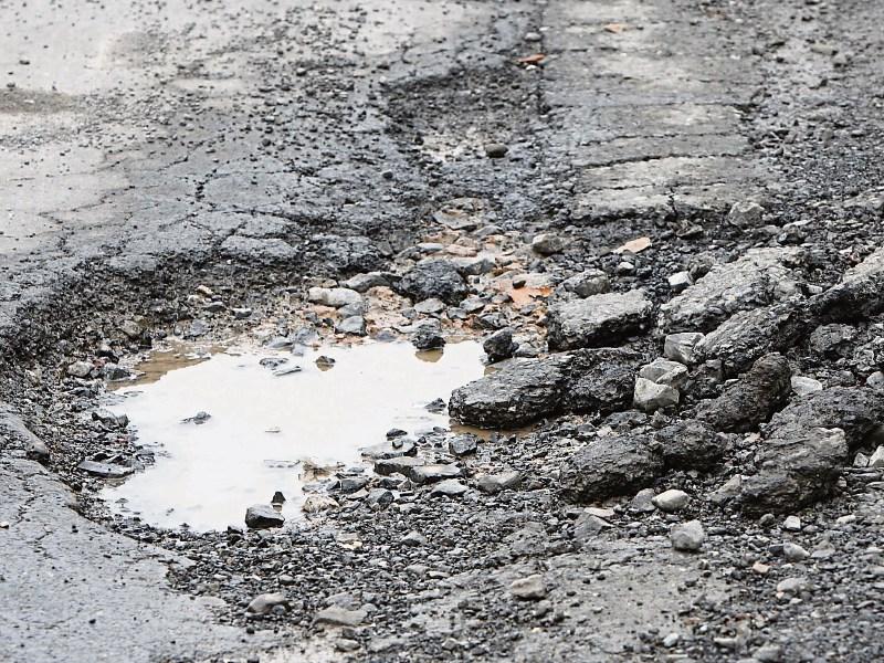 Water bursts may have caused subsidence to road