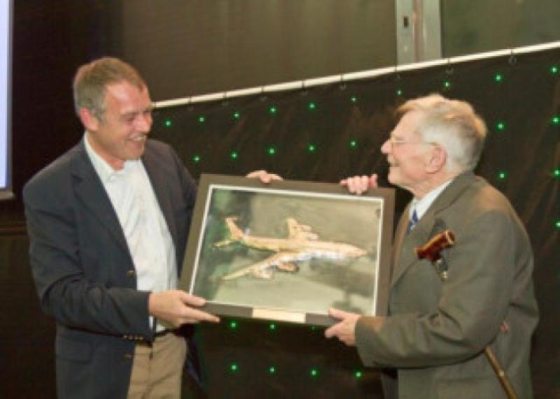 Aer Lingus CEO, Christoph Mueller presents the piece to Michael Forde, a former Principal of the Aeronautical Department in the College of Technology, Bolton Street.