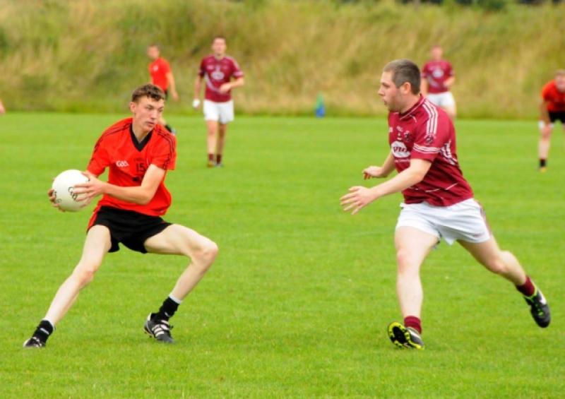 Gavin Kelly on the attack for Cashel in his bid to evade the challenge of Kenagh opponent Ian Farrell. Action from the Intermediate Football Championship Round 1 game at the Clonbonny grounds. Photo: Kevin Leavy/Declan Gilmore Photography