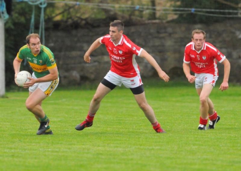 David Farrell on the ball for Ardagh in breaking away from Ballymahon opponents Kevin Diffley and Matthew Daly. Action from the Senior Football Championship Round 1 game at Pairc Chiaran, Newtowncashel on Monday evening last. Photo: Declan Gilmore Photography
