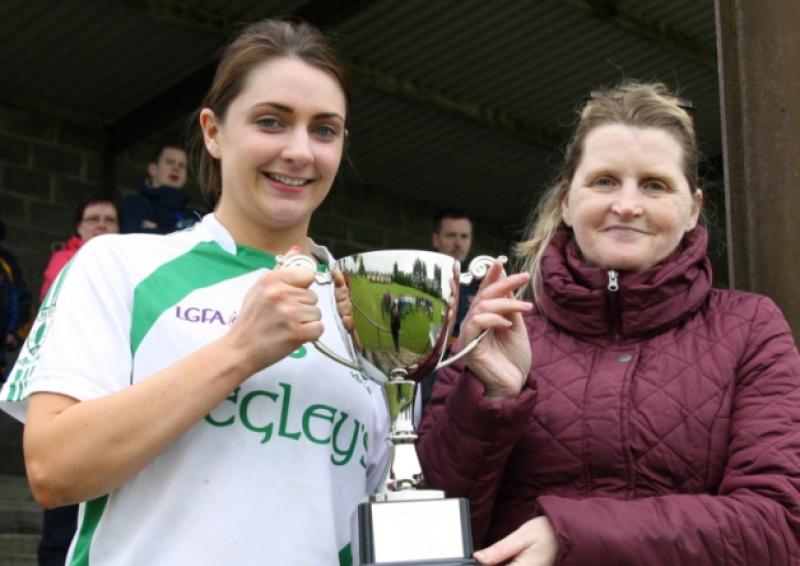 Killoe captain Edel Quinn receiving the Ladies Division 1 Senior League Top Four Cup from Marie Matthews. Photo: Charlie Canning