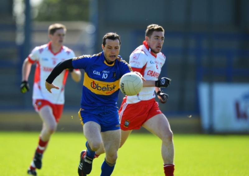 James Martin on the attack for Dromard as Shane Mahon of Abbeylara gives chase during the Senior Football Championship Semi Final on sunday last at Pearse Park. Photo: Ray Donlon