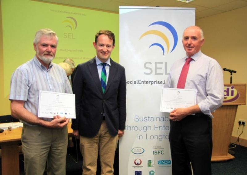 Padraig Gallogy and Tom Chapman from Longford REVAMP 3R with T.D Sean Sherlock Minister of Social Enterprise. Photo: Michelle Ghee. www.gphotos.ie