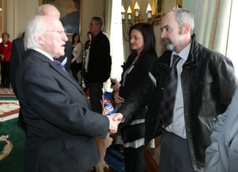 Local resident and volunteer, Patrick Sherlock with President Higgins, pictured at the recent visit to the Aras.