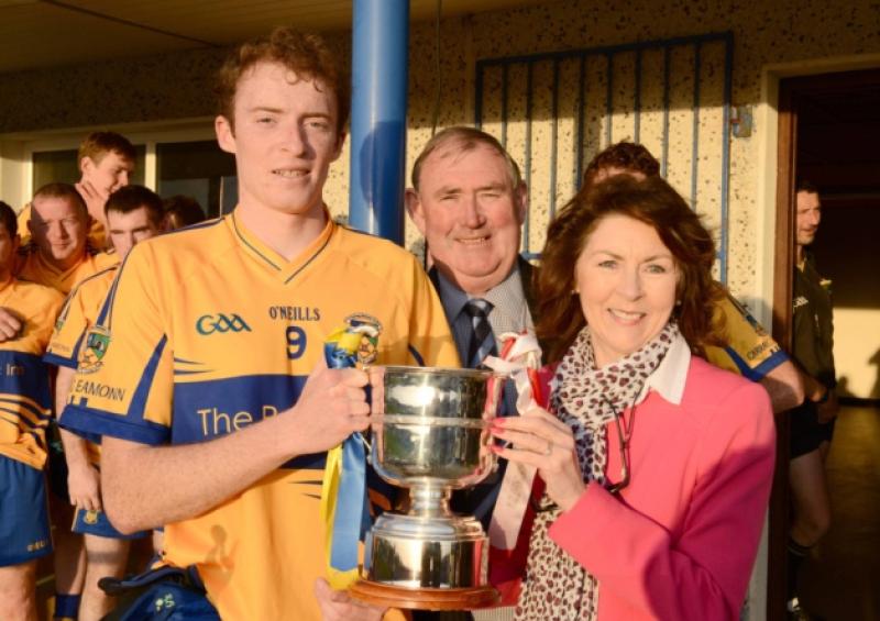 Anne Hennessy presenting the Gerry Hennessy Cup to Carrickedmond captain Barry O'Farrell with County Board Chairman Brendan Gilmore also in the picture. Photo: Declan Gilmore Photography