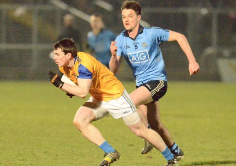 Liam Connerton on the attack for Longford in breaking away from Dublin defender Eric Lowndes. Photo: Declan Gilmore
