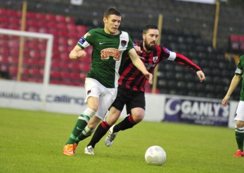 Longford Town captain Mark Salmon battling for the ball in this tussle with Cork City opponent John Dunleavy. Action from the Premier Division league clash at City Calling Stadium on Saturday evening last. Photo: Frank McGrath