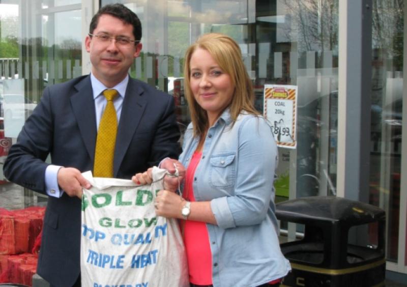 Independent Euro Election Candidate for Midlands North West Constituency, Senator Ronan Mullen with Joan Gillespie from Newtowncunningham discussing the Carbon Tax introduced on May 1 which will increase the price of household fuels.
