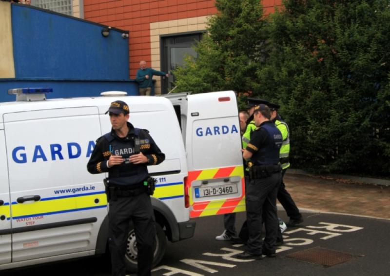 The defendant being led away from Longford courthouse after being charged with four counts of rape against two young girls.