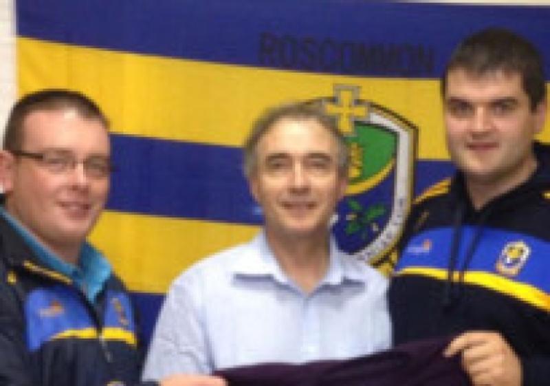 An ecstatic 'Rossie' is reunited with his 'good jumpe' by Supporters Club Chairman Brian Carroll and Treasurer Tom Murray.