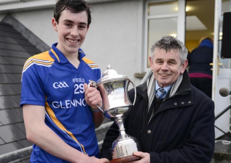 Martin Skelly, on behalf of the Leinster Council, presents the Leinster Minor Football League Cup to Longford captain Shane Kenny from Lanesboro. Photo: Declan Gilmore