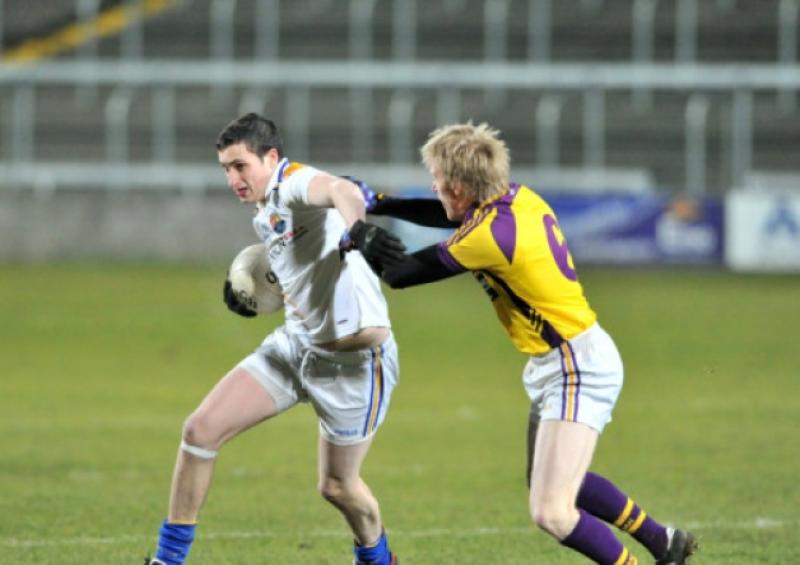 Darren Gallagher in action for Longford against Dermot O'Keefe of Wexford during the Leinster U-21 Football Championship Semi Final on Wednesday of last week at O'Moore Park, Portlaoise. Photo: Ray Donlon
