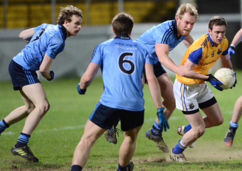 Liam Connerton on the attack for Longford surrounded by Dublin players.