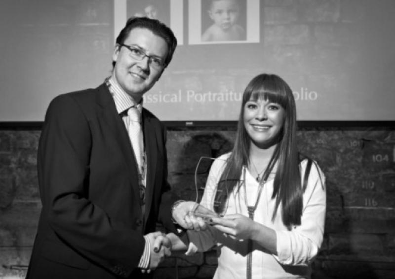 A delighted Longford town based photographer, Claire Durkin, is pictured receiving her award for the Best Portrait Portfolio at the prestigious IPPA national awards recently. Photo: John Ohle Photography.
