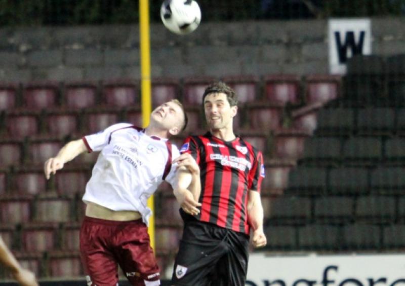 Longford Town defender Willie Tyrell is first to the ball in this aerial tussle. Action from the Airtricity League First Division game at City Calling Stadium on Saturday evening last.