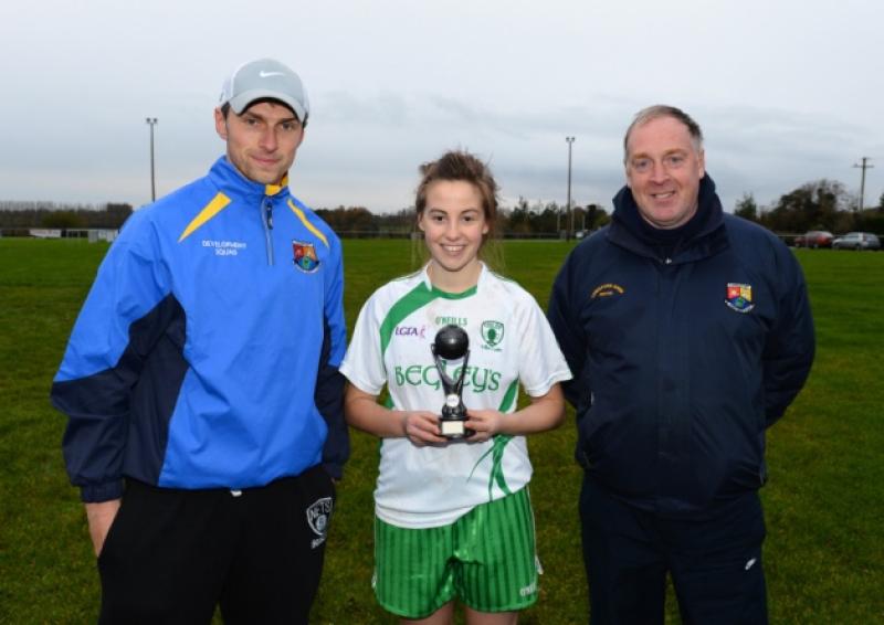 County team selector Michael Kenny and Committee Member Charlie Canning presents the Ladies Senior Football League Final Player of the Match Award to Killoe player Mary Reynolds on Saturday last at Maguire Park. Photo: Ray Donlon