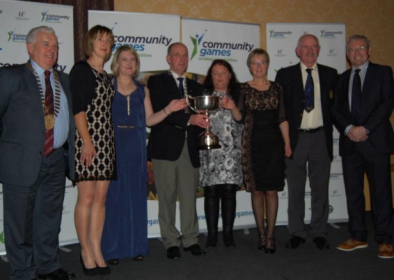 Ballymahon-Forgney Community Games pictured receiving the Overall National Area Award from by the organisation's President, Gerry Davenport. Also in photo are Community Games Vice President Joe Fox and Tony O'Donoghue of RTE Sport.