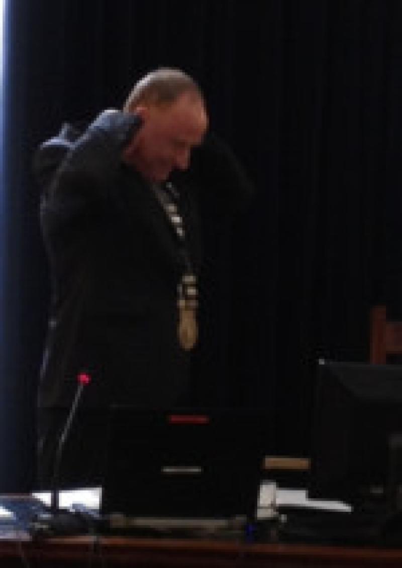 New County Mayor, Cllr Larry Bannon places the Mayorial chain around his neck.