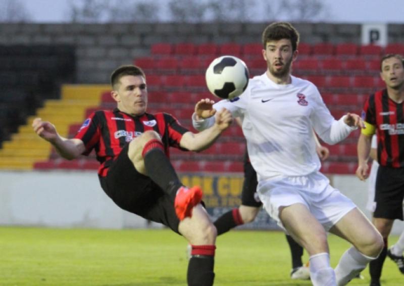 Longford goal hero David O'Sullivan attempts to control the ball despite the close attention of a Cobh Ramblers defender. Photo: Syl Healy