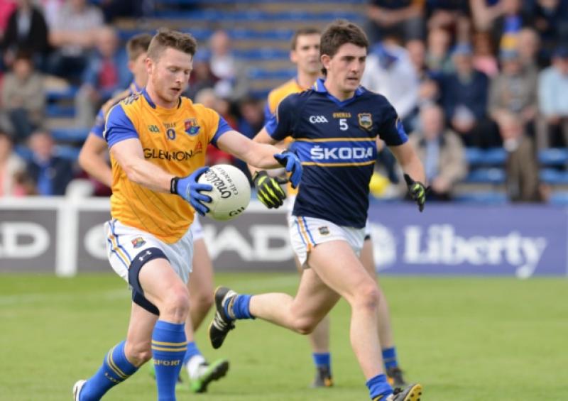Michael Quinn on the ball for Longford in breaking away from Tipperary defender Colin O'Riordan. Action from the All-Ireland Qualifier Round 2A game at Semple Stadium in Thurles on Saturday evening last. Photo: Declan Gilmore Photography