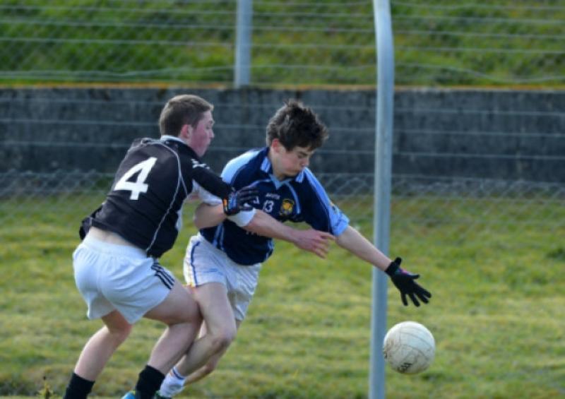 Cnoc Mhuire Granard player Rian Brady battles with Cian O'Donovan of Clonakilty Community College during the All-Ireland Vocational Schools Senior 'A' Football Championship Semi Final on Saturday last at the Tipperary Town grounds. Photo: Ray Donlon