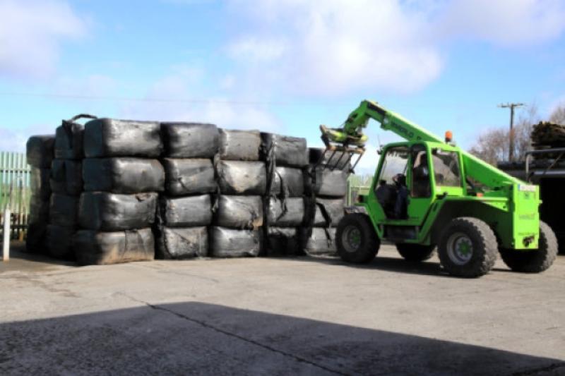 Colm O'Hara stacking the Imported Bales of Hay that arrived at Longford's Town and Country store last Friday.  Photo:  Micheel Ghee