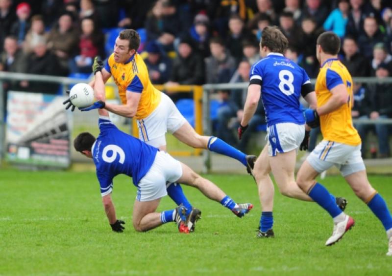 Michael Brady on the ball for Longford in this tussle with Cavan opponent Killian Brady while also in the picture are Gearoid McKiernan (Cavan No 8) and Shane Mulligan (Longford). Action from the National Football League Division 3 game at Glennon Brothers Pearse Park on Sunday.