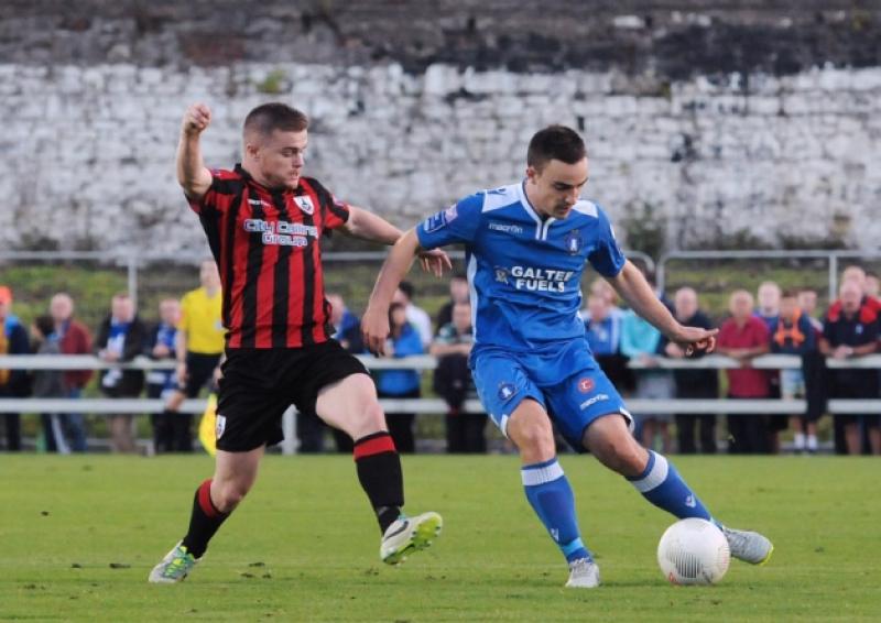 Longford Town player Lorcan Shannon in a tussle with Limerick FC opponent Shane Tracy in the league game at the Markets Field. Photo: Gareth Williams