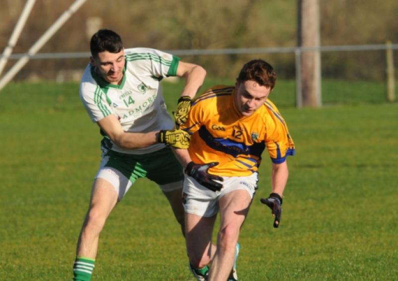 Liam Hughes (Killoe) and Dara Flynn (Carrickedmond/Legan) battlnig for the ball in the Under 21 'A' Football Championship semi-final at Keenan Park on Sunday last. Photo: Declan Gilmore Photography