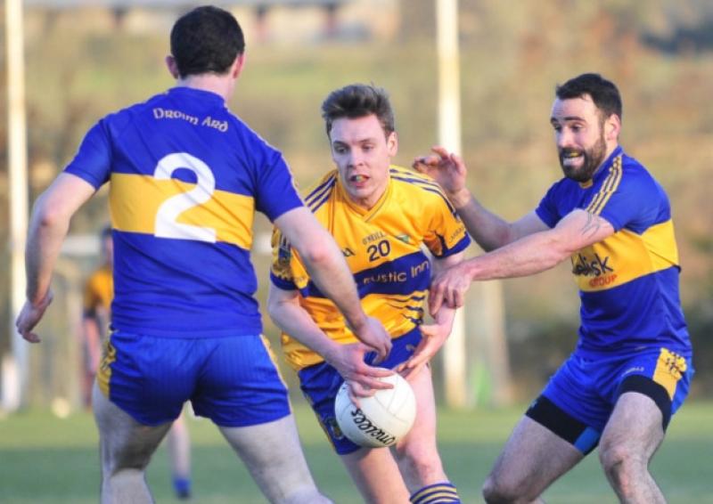 John Burns on the ball for Carrickedmond in this tussle with Dromard opponent Diarmuid Masterson. Action from the All County Football League Division 1 game at Pairc na Gael on Saturday evening last.  Photo: Frank McGrath