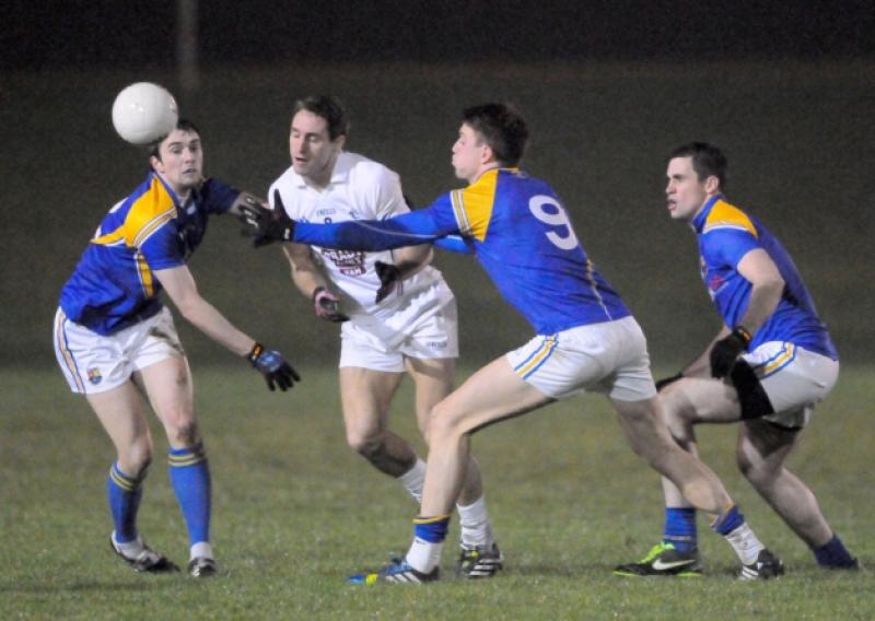 Longford midfielder John Keegan beats Kildare's Gary White to the ball during last Wednesday's Bord na Mona O'Byrne Cup encounter in Newtowncashel. Photo: Declan Gilmore