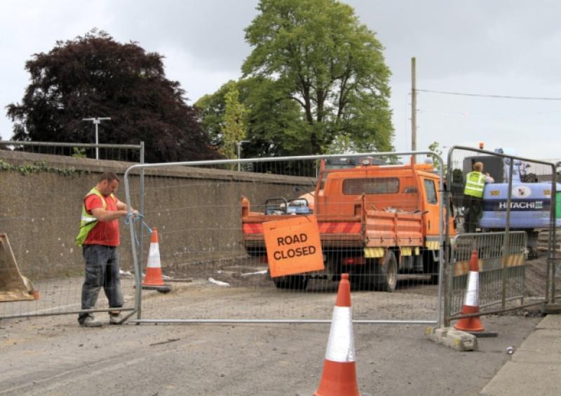 Workers on site at the St Mel's Road repair project. Photo: Michelle Ghee. www.gphotos.ie