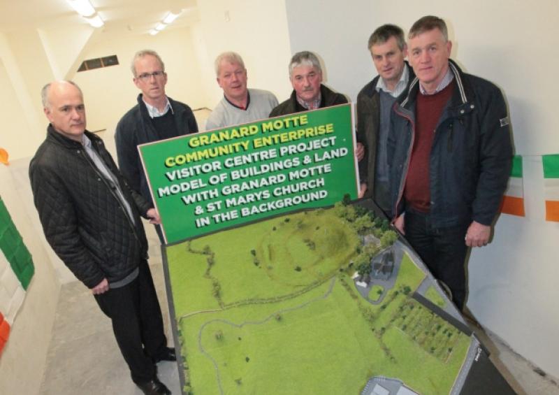 Paul Flood, Philip Smith, Seamus Gordon, Willie Monaghan, Padraig McGauran, and Padraig McGivney with the model of the proposed visitor centre. Photo: Shelley Corcoran