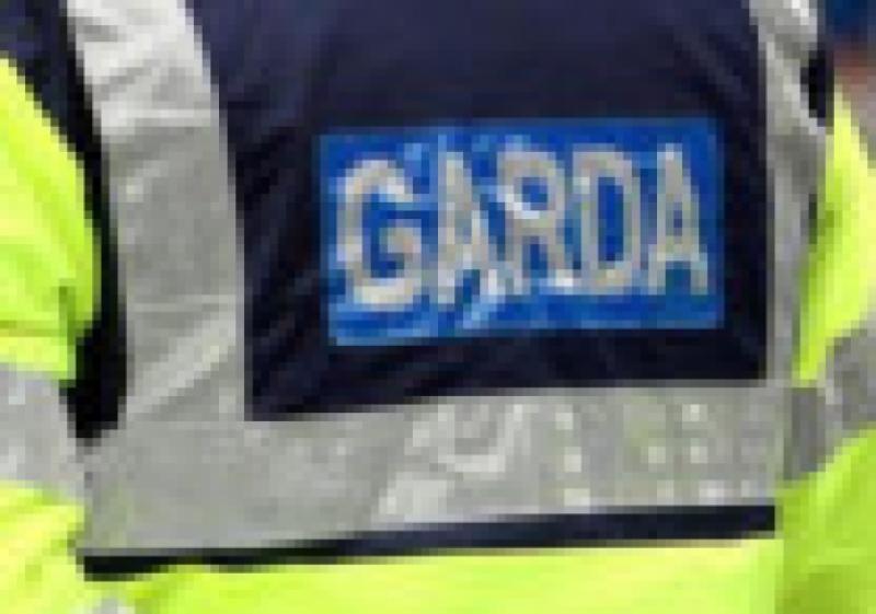 Gardai were forced to run for cover from a man brandishing knives following an incident in Longford town on Sunday.