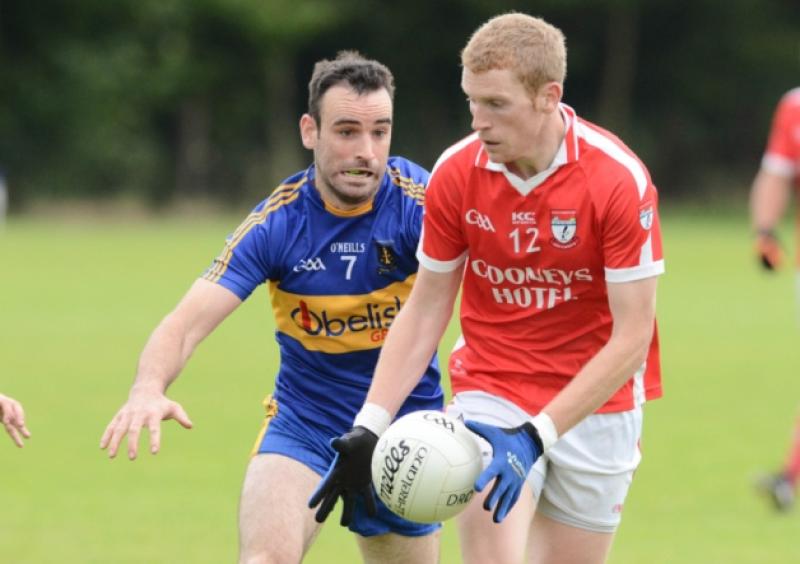 Colm Flynn on the ball for Ballymahon in his attempt to evade the determined challenge of Dromard opponent Diarmuid Masterson. Action from the Senior Football Championship play-off at the Higginstown grounds, Granard on Saturday evening last. Photo: Declan Gilmore Photography