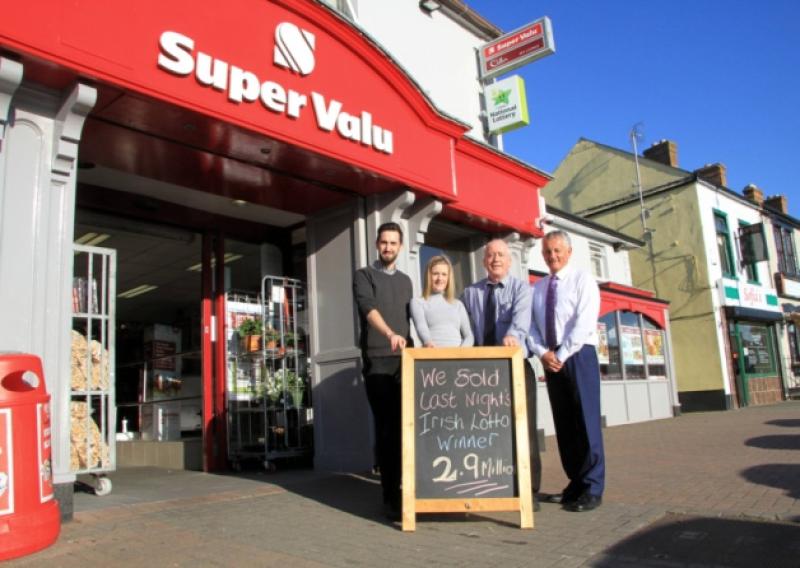 Pat Smyth of Smyth's SuperValu in Ballymahon (right) with staff members Fergal O'Toole, Edel Lyons, and Larry Cooney, pictured outside the supermarket after learning it had sold the winning Lotto ticket last week. Photo: Michelle Ghee. www.gphotos.ie