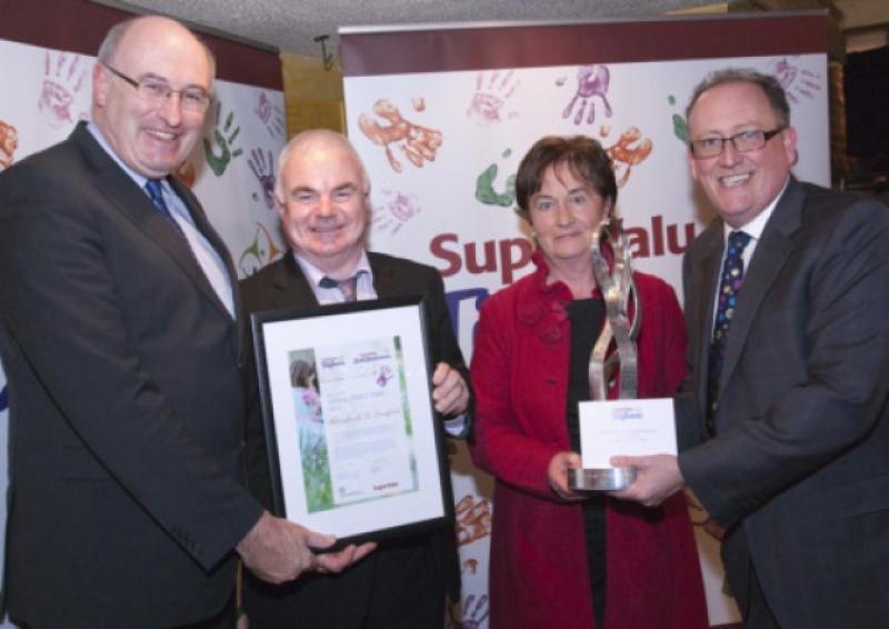 Minister Phil Hogan presents the National Award Winner for 2012 with a trophy to Philip Butler and Margaret Dowler - Abbeyshrule Tidy Towns Committee, with Martin Kelleher, Managing Director, SuperValu.  [Photo: Derek Cullen, F�ilte Ireland]