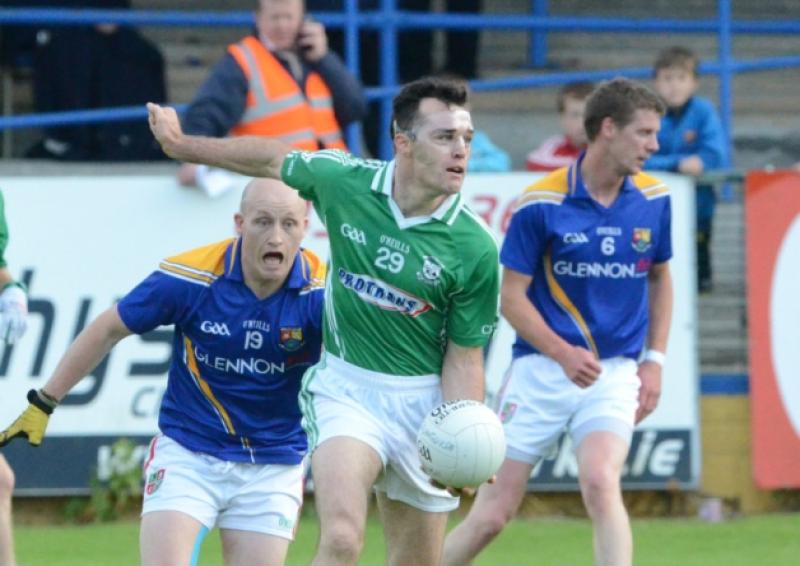 Paul Barden (wearing a protective face mask) on the ball for Clonguish and evading the challenge of Colmcille opponent Padraig Murtagh with Noel Farrell also in the picture. Action from the Senior Football Championship quarter-final at Glennon Brothers Pearse Park on Saturday evening last.  Photo: Declan Gilmore