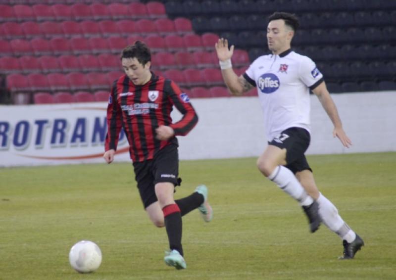 Jamie Mulhall surging forward for Longford Town in breaking away from Dundalk opponent Richie Towell. Action from the Premier Division league game at City Calling Stadium on Saturday night last.  Photo: Declan Gilmore